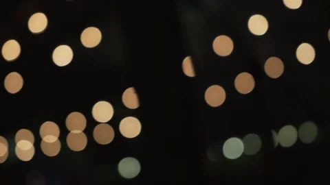 Panning Shot of Out of Focus Lights at a Party Stock Footage 103240736