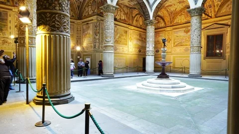 Panning shot of Palazzo Vecchio interior with arches, frescoes and columns Stock Footage 120428478