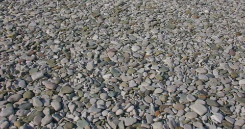 Panning shot of Pebbles on the beach at pensarn, north Wales 動画素材 346191570