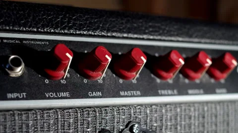Panning shot of plugging into a guitar amplifier Stock Footage 29935850