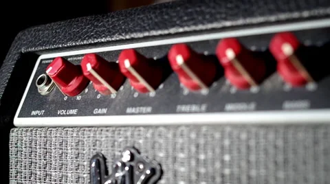 Panning shot of plugging into a guitar amplifier 스톡 동영상 29960850