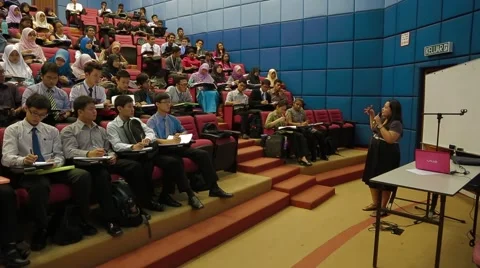 Panning Shot of Professor Teaching A Full Class of Students in Penang Stock Footage 49388671