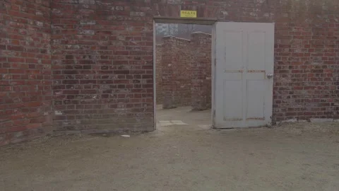 Panning shot of a red brick construction outside Video stock 299893440