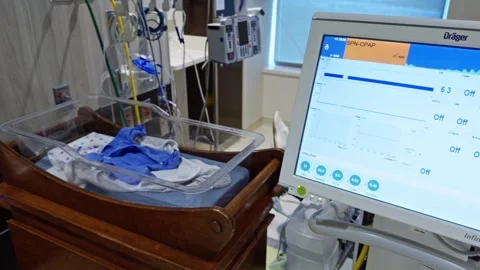 Panning Shot Revealing Empty NICU Hospital Bassinet and Medical Equipment Video stock 338276964