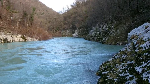 Panning shot from right to left of Soča river Video stock 104478639