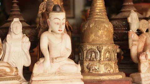 Panning shot of rows of antique Buddhist relics, Thailand  Stock Footage 94859079