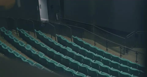 Panning shot of rows of empty movie theater seats in cinema auditorium Stock Footage 197129508