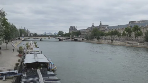 A panning shot of the Seine river with iconic Paris cityscape. Stock Footage 278919787