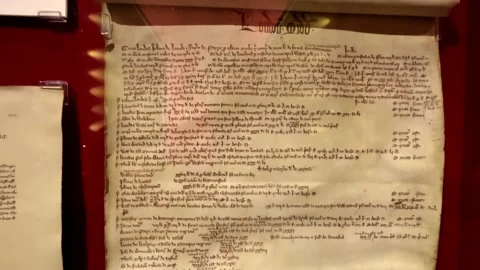 Panning shot showcasing an ancient written Scottish script on showcase Stock Footage 229768629