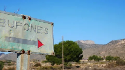 Panning shot of a sign stating "bufones" (buffoons) Video stock 169252893