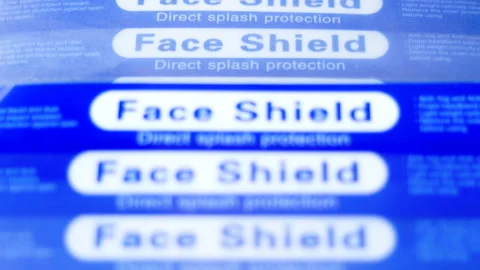 Panning shot of stack of face shield Video stock 145171792