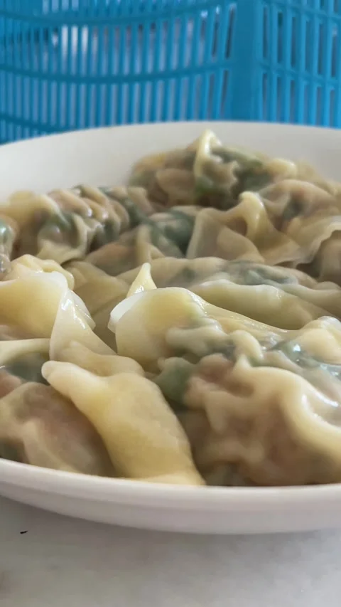 Panning Shot Of Steaming Hot Cooked Pork Dumplings On Plate Stock Footage 330565811
