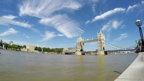 Panning shot of Tower bridge and Financial District of London on a sunny day Stock Footage 79504647
