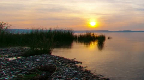 Panning shot of Tracking time lapse of the Sea of Galilee at sunset Stock Footage 54098740