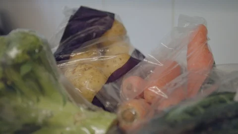 Panning Shot of Vegetables in Plastic Packaging Stock Footage 95187468