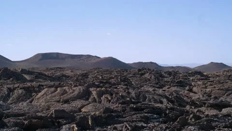 Panning shot of volcanic igneous rock, Timanfaya, Spain. 4k Stock Footage 154553661