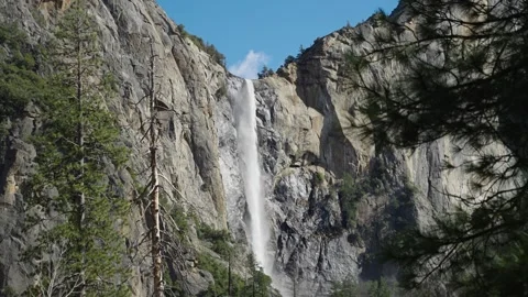 Panning up shot of a water fall on the cliffs of Yosemite National Park Stock Footage 278020230