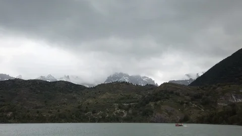 Panning shot of water surface under high mountains, Patagonia, Chile Stock Footage 137965169