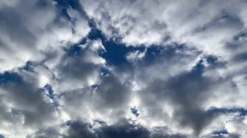 Panning Shot of White Clouds Floating In Dark Blue Sky Stock Footage 167483762