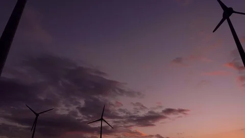 Panning shot of wind generators at sunset. Stock Footage 97465739