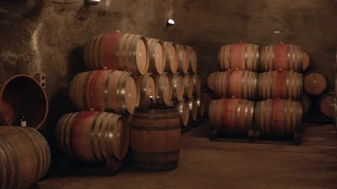 Panning shot wine barrels in cave, Queenstown Stock Footage 89811348