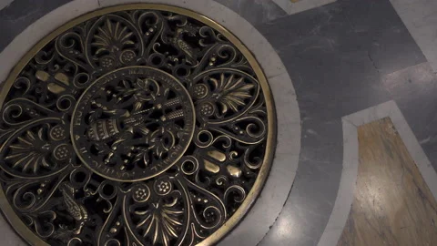 Panning shot of wishing grate in the Floor of St Peters Basilica, Rome Stock Footage 137554341