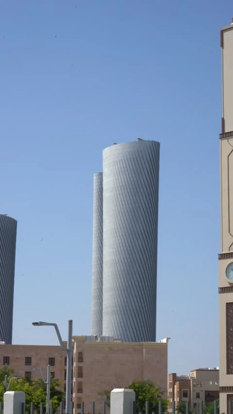 Panning Shot of Zig Zag Towers and Clock Tower in Doha Qatar Stock Footage 341301217