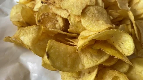 Panning in slow motion over a stack of chips Stock Footage 141977257