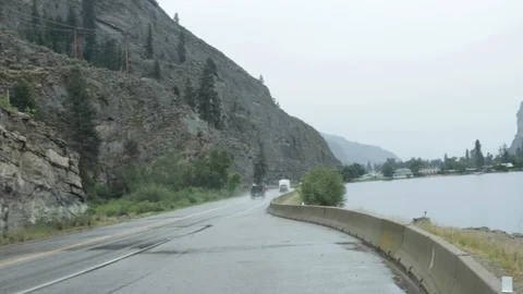 Panning a small lake on the side of the road Stock Footage 100046823