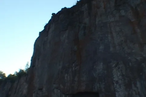 Panning straight up cliff fr below Pallisade Head Stock Footage 124672869
