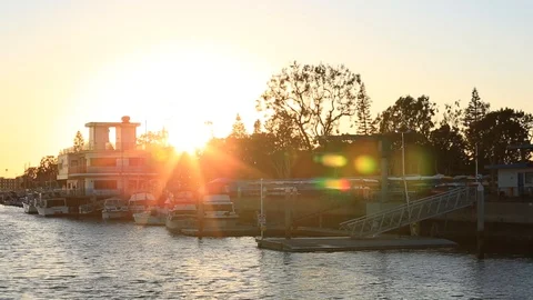 Panning from sunset to boats in dock 스톡 동영상 86297743