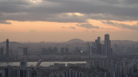 Panning sunset time lapse of Seoul city skyline at sunset view from Namsan N  Stock Footage 229012775
