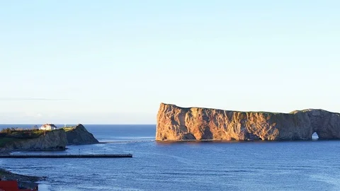 Panning of sunset view at Rocher Perce rock in Gaspe Peninsula, Quebec, Gaspesie Stock Footage 92697521