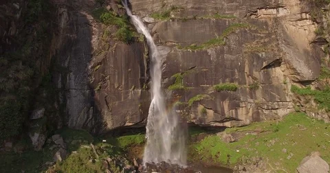Panning Up Tall Cliff Waterfall Stock Footage 81003829