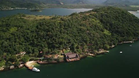 Panning Through The Edge of a Private Island, Seeing Ocean Front Beach Homes, 4k Stock Footage 239685871
