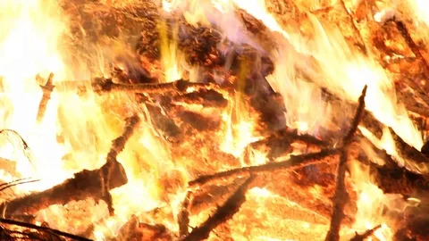 Panning thru the fire up into the embers Stock Footage 122355531