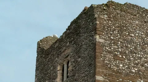 Panning time-lapse of clouds passing behind a tower of Dover Castle Stock Footage 54103902