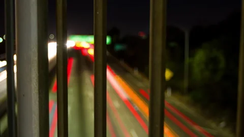 Panning Time Lapse Defocused View Of Illuminated Cars Moving On Roads In City At Stock Footage 297592636