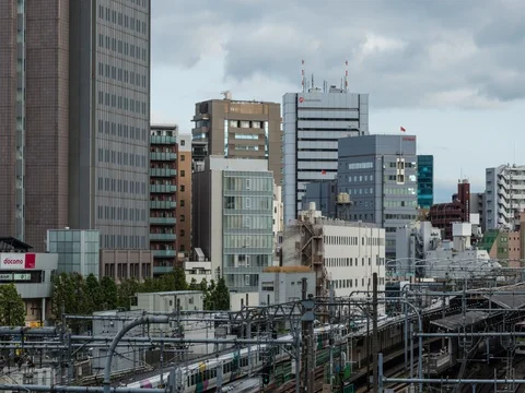 Panning time-lapse footage of the cloudy sky over Shinjuku area, Tokyo, Japan Stock Footage 76387758