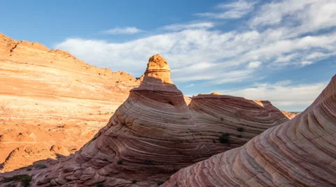Panning Time Lapse as Red Rock Lights up and Clouds Move Across the Sky Video stock 62206250