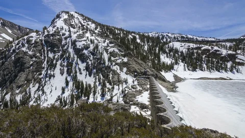 Panning Time-lapse of a Snow Covered Mountain and Lake Stock Footage 93340081