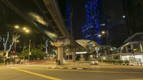 Panning timelapse night scene of the road intersection of Sultan Ismail Stock Footage 107676031