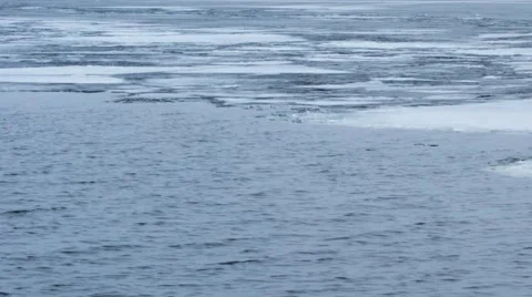 Panning. Timelapse of water waves on partly frozen lake Stock Footage 47345498