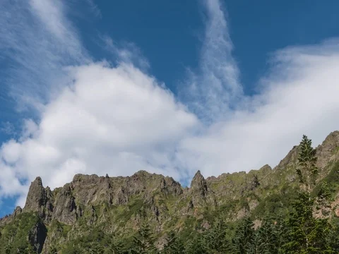 Panning timelapse of white clouds over mountain group, Nagano Prefecture, Japan Stock Footage 80618658