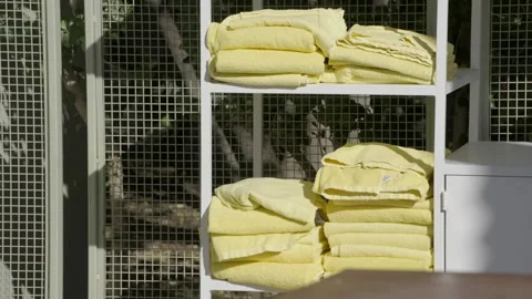 Panning towels by a pool Stock Footage 308044057