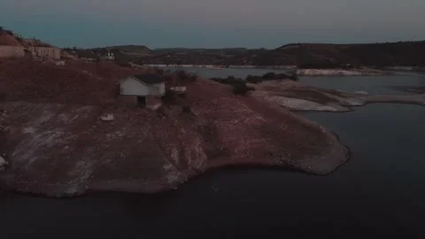 Panning at Twilight over a dwindling lake in the semidesert Zimapan, Tziban.. Stock Footage 304303365
