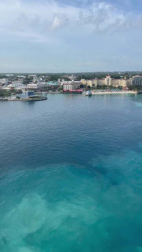Panning vertical shot left to right of cruise ship docking in nassau bahamas Stock Footage 336659987