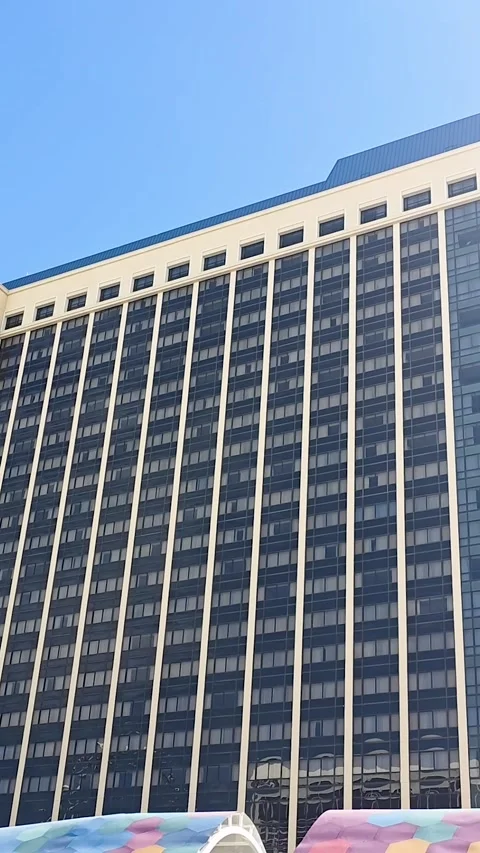 Panning Vertical Shot of Multistory Hotel and Eiffel Tower Replica on Las Vegas Stock Footage 331162136