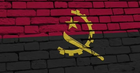 A panning video of a brick wall with the angola flag Stock Footage 337426893
