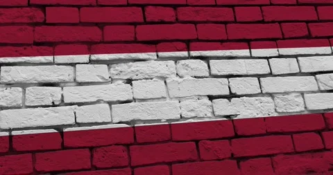 A panning video of a brick wall with the austria flag Stock Footage 337426970